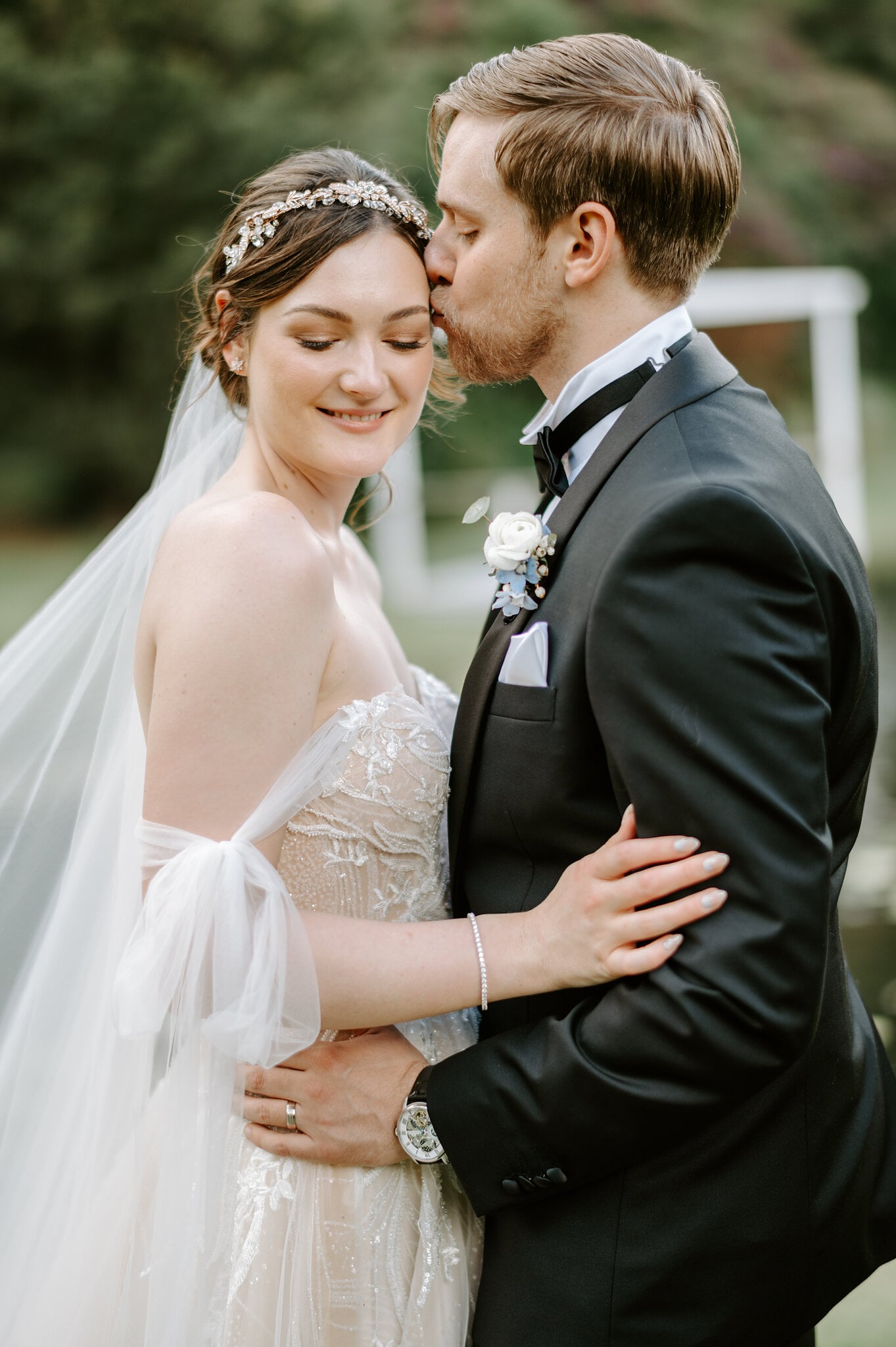 Tim kisses Jamie’s temple as she closes her eyes and smiles.