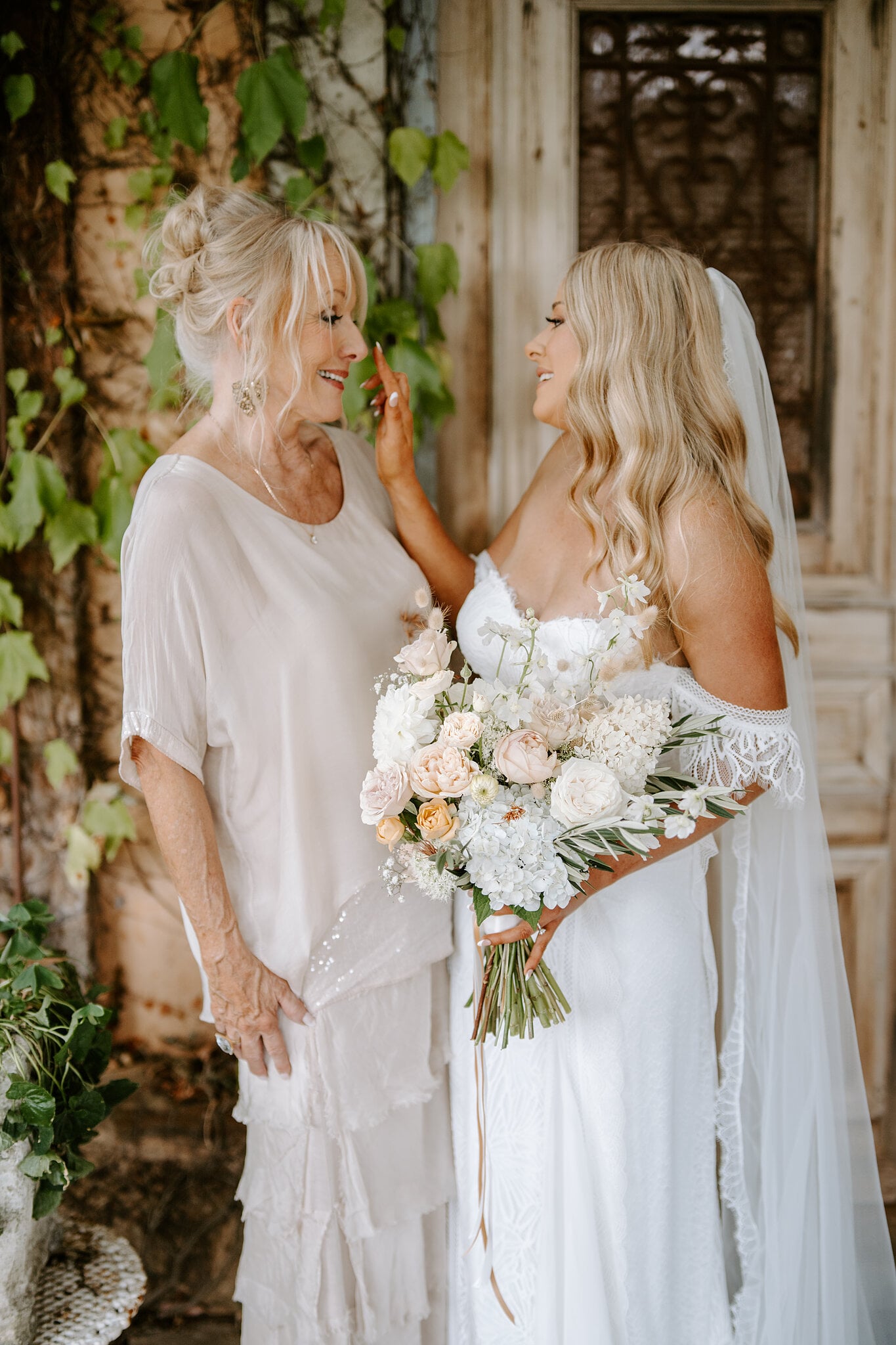 Samantha’s mum touches her face as they share a smile before the ceremony.