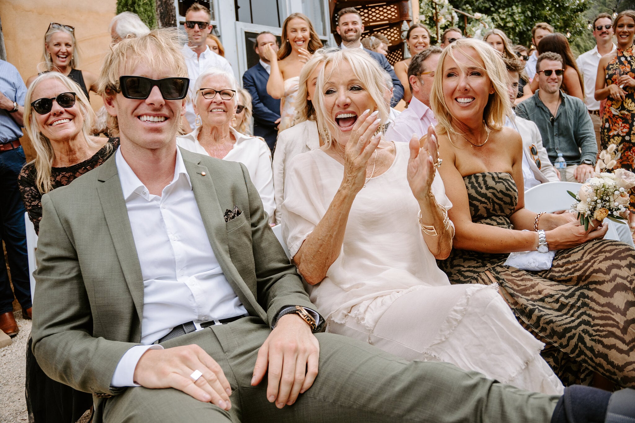 Samantha’s brother and mum cheer with the guests as the couple are pronounced married.