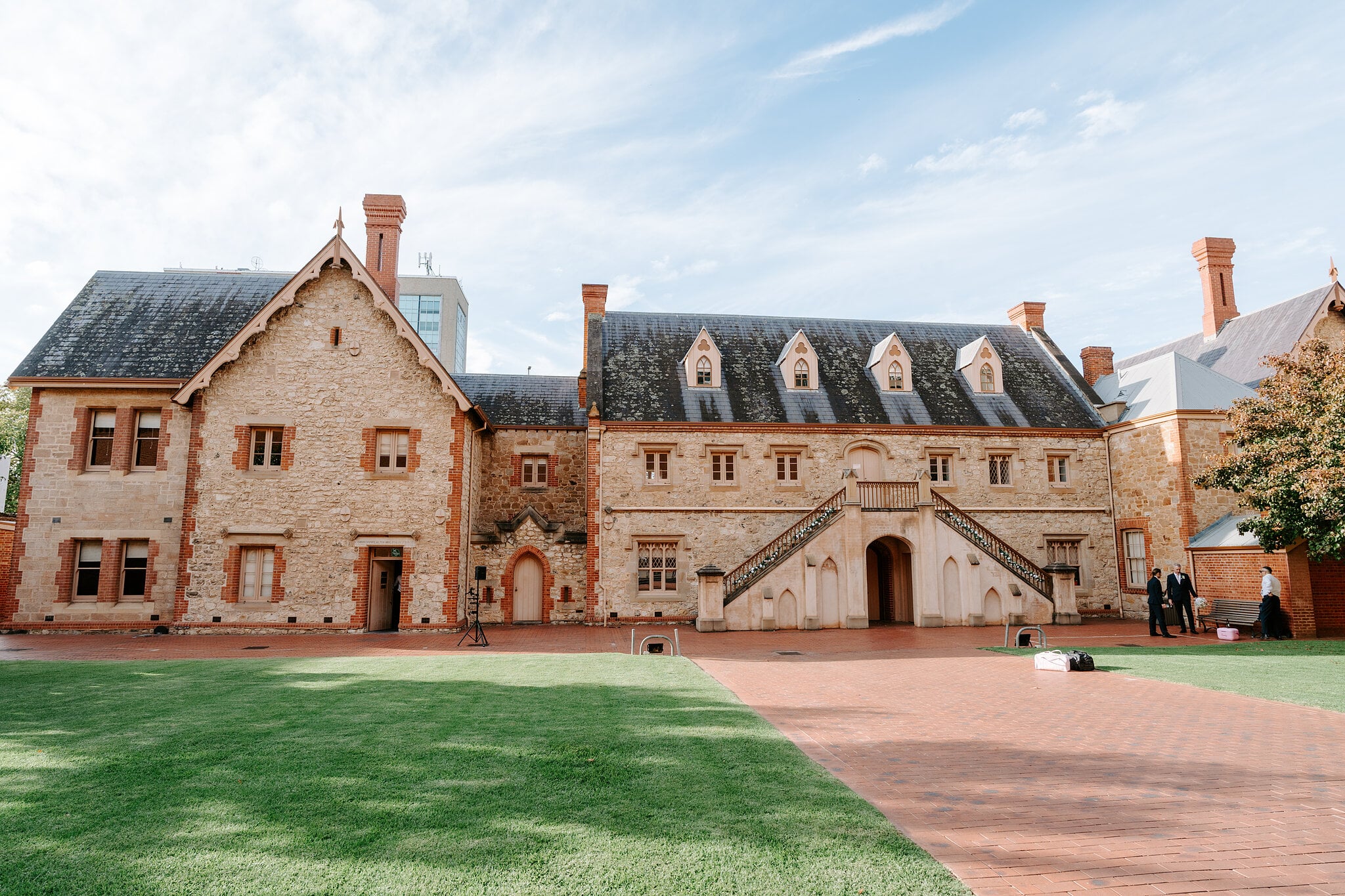 The Armoury courtyard at the South Australian Museum, its lawn, red-brick path and twin stone staircase ready for the ceremony.