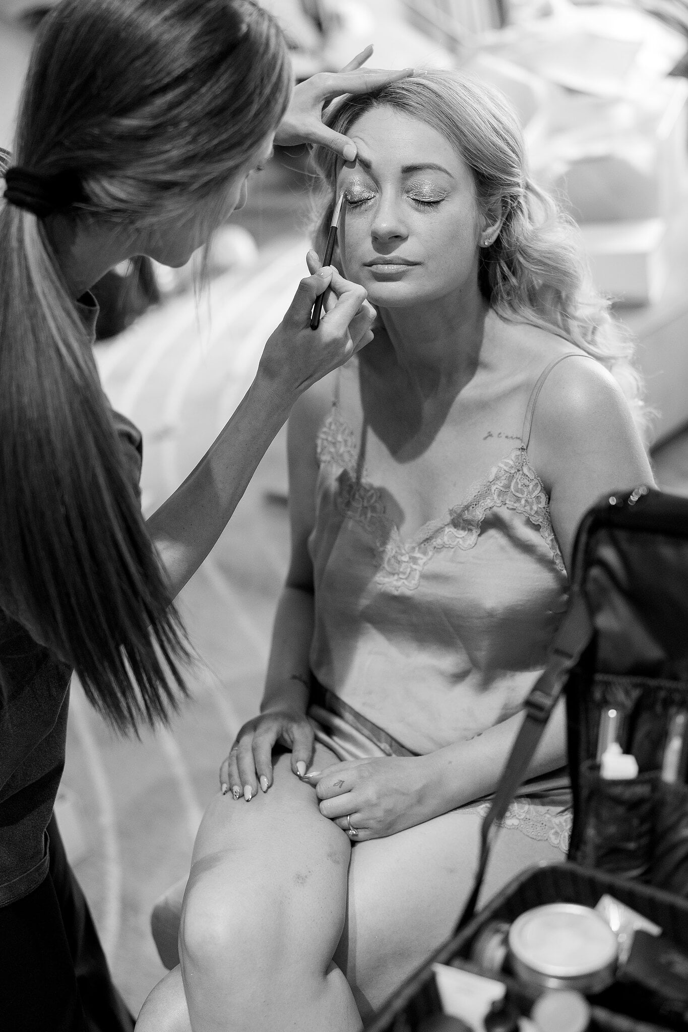 Sarah closes her eyes as her make-up is finished in her suite at The Playford Hotel, in black and white.