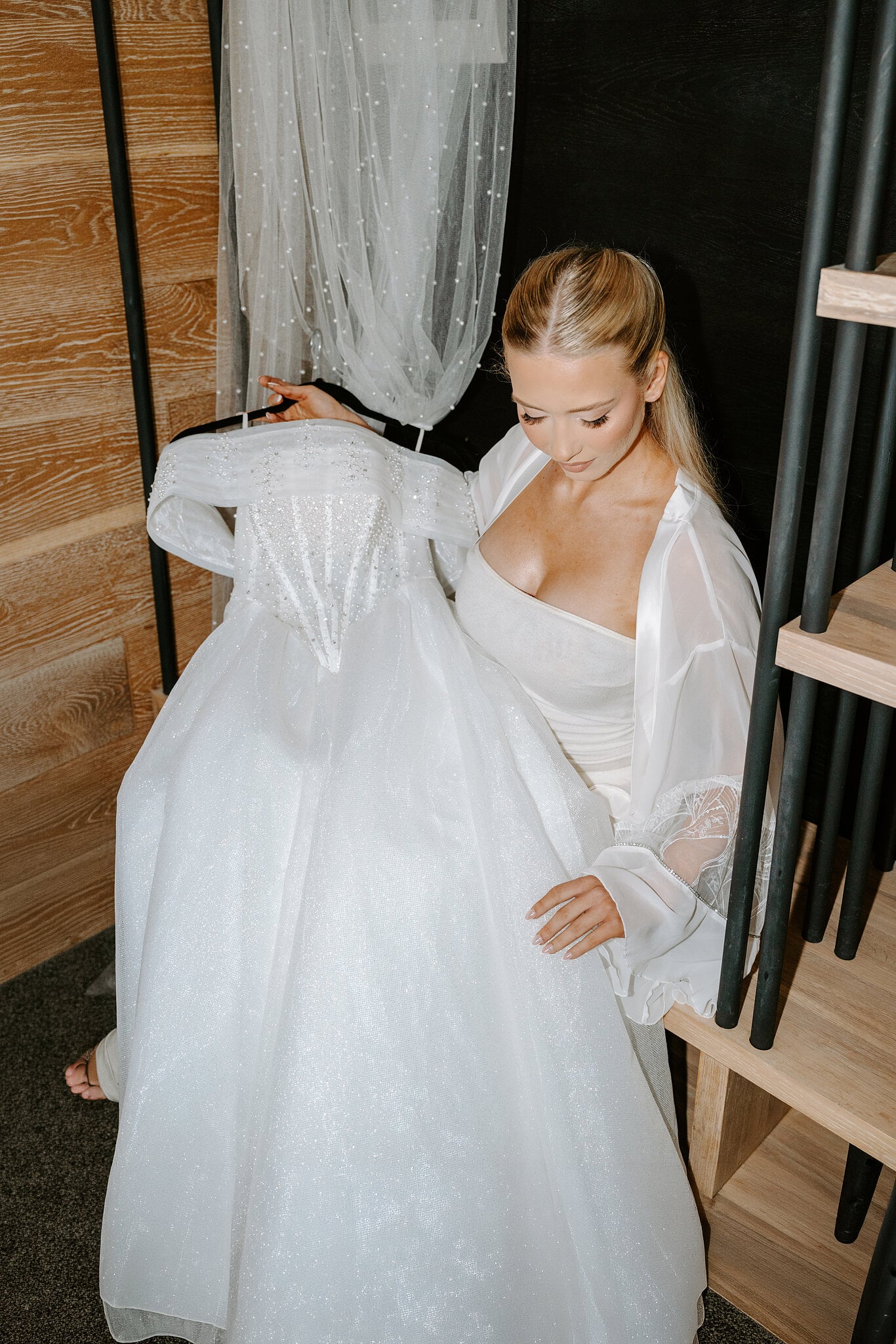 Sorayaa admires her sparkling ball gown hanging in her suite at The Island.
