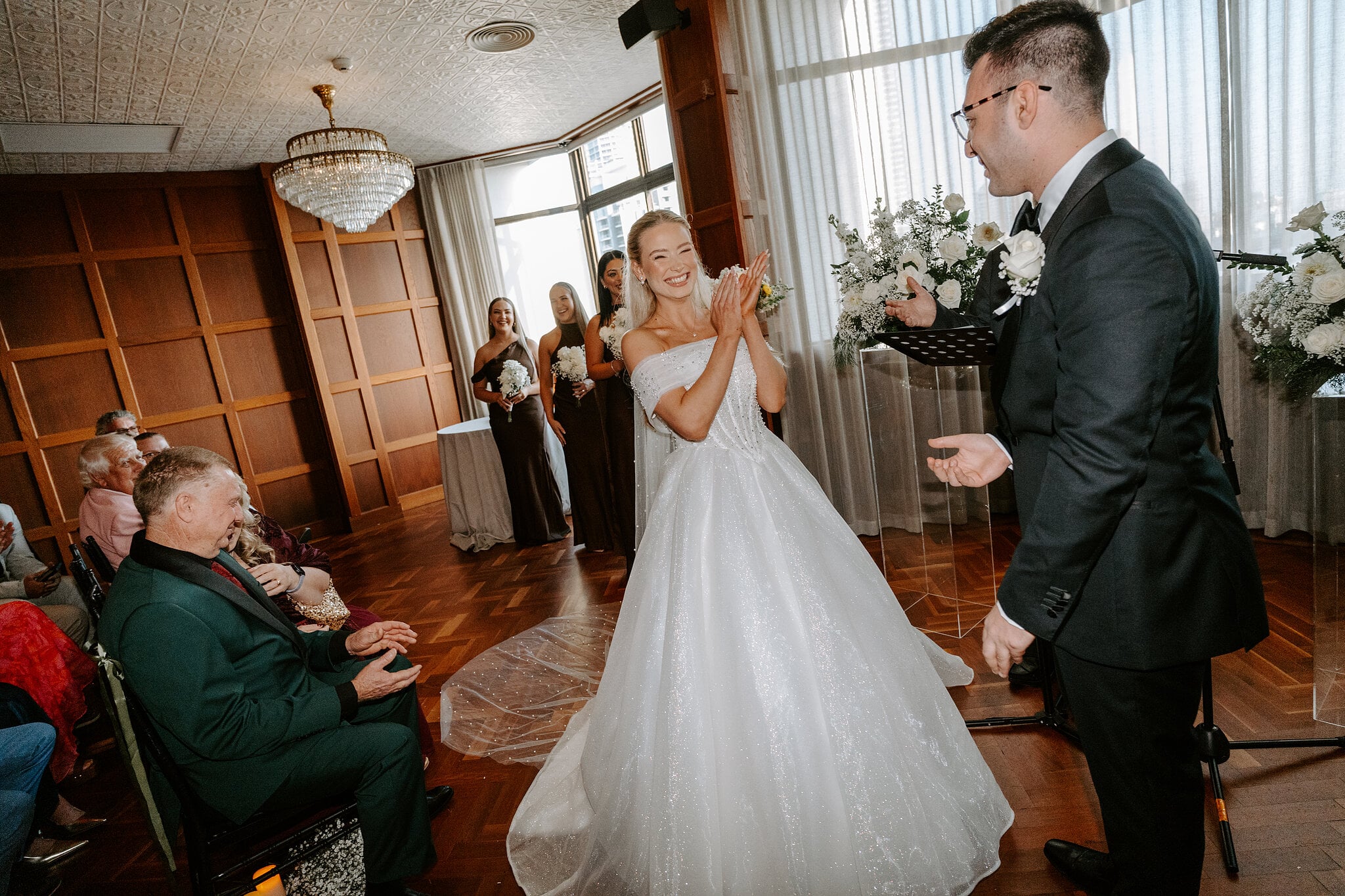 Sorayaa claps with delight mid-ceremony as Jordan grins.